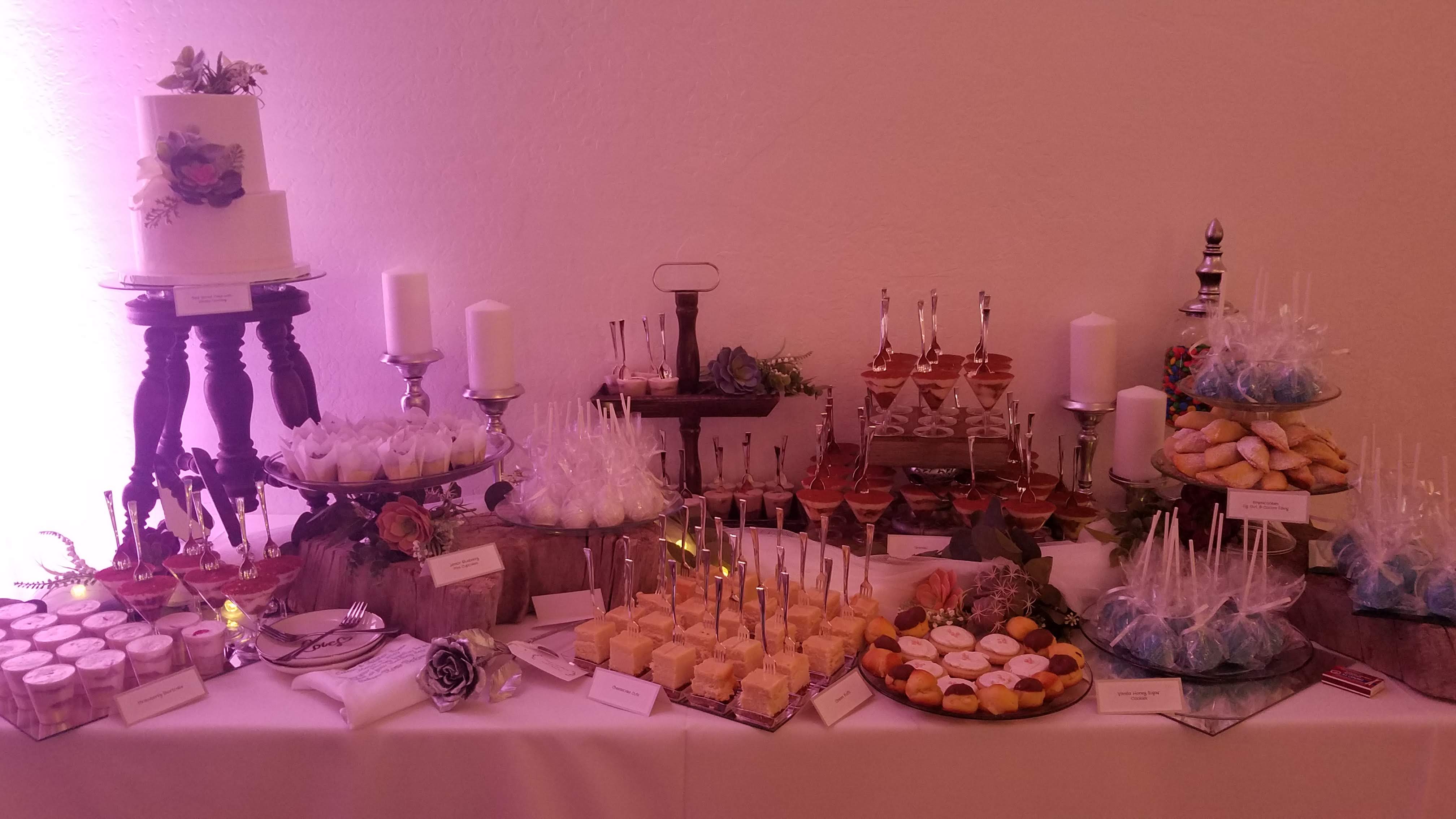 Two tier wedding cake and dessert table